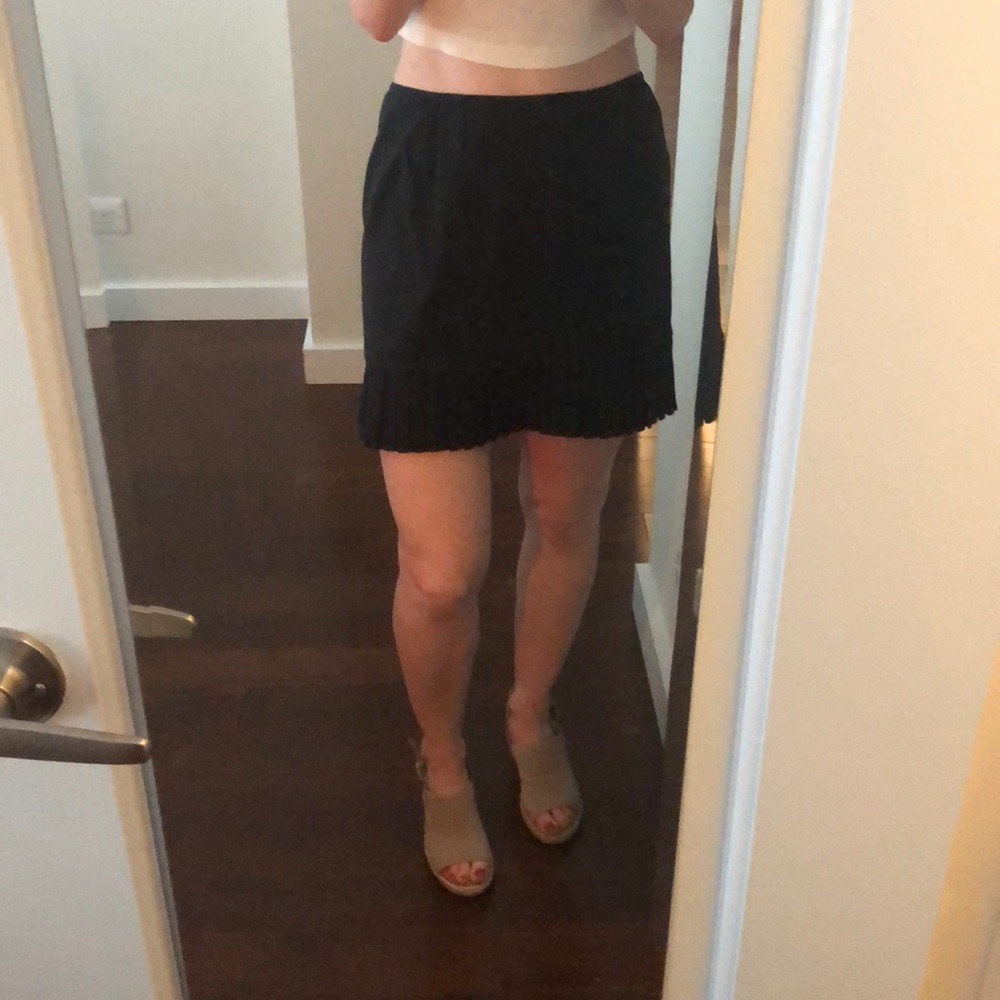 Pleated black mini skirt